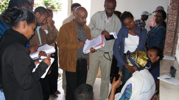 Ethiopian journalists interview a woman during a journalist training session